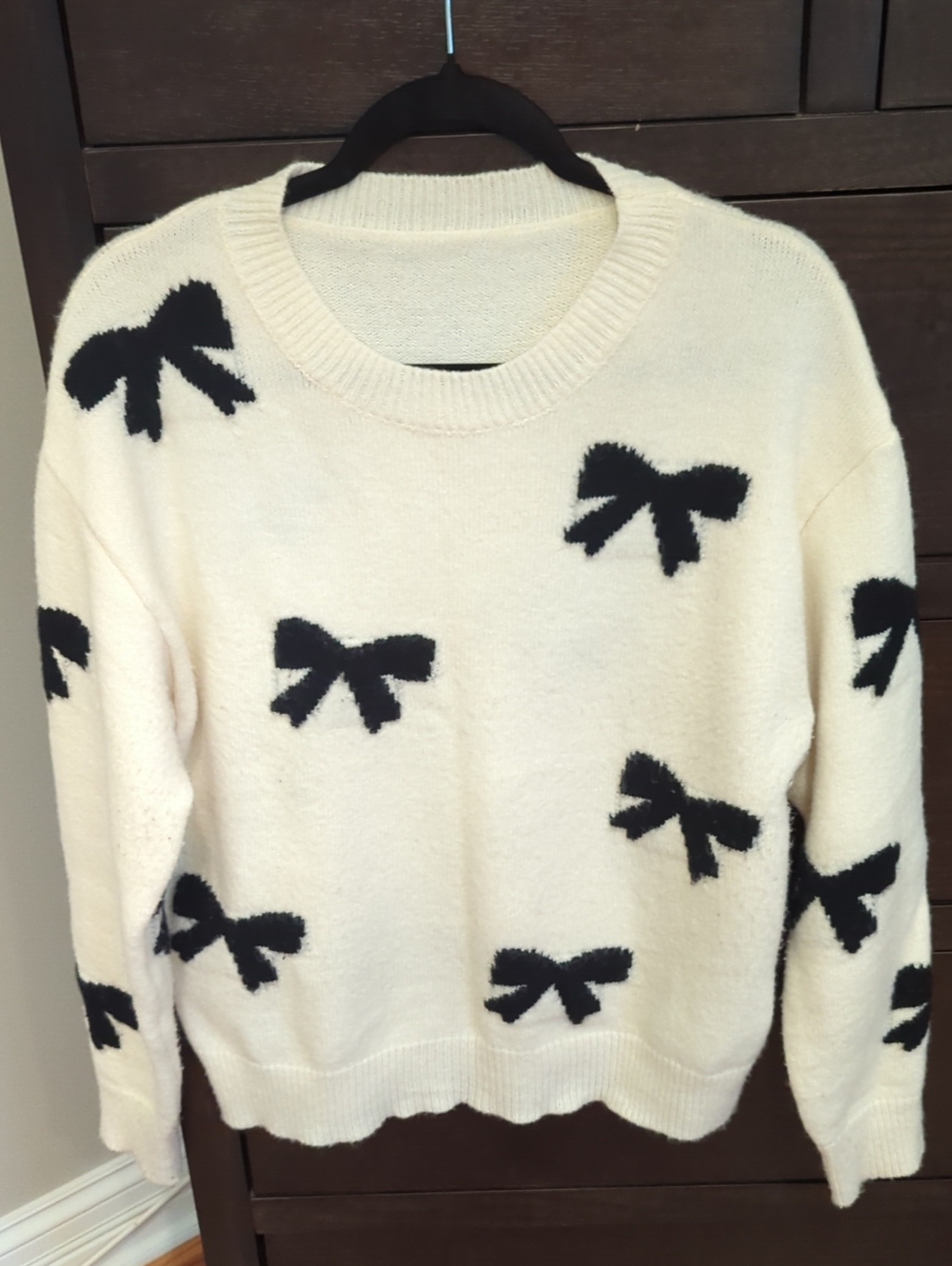 Women’s Cream Sweater with Black Bow Pattern